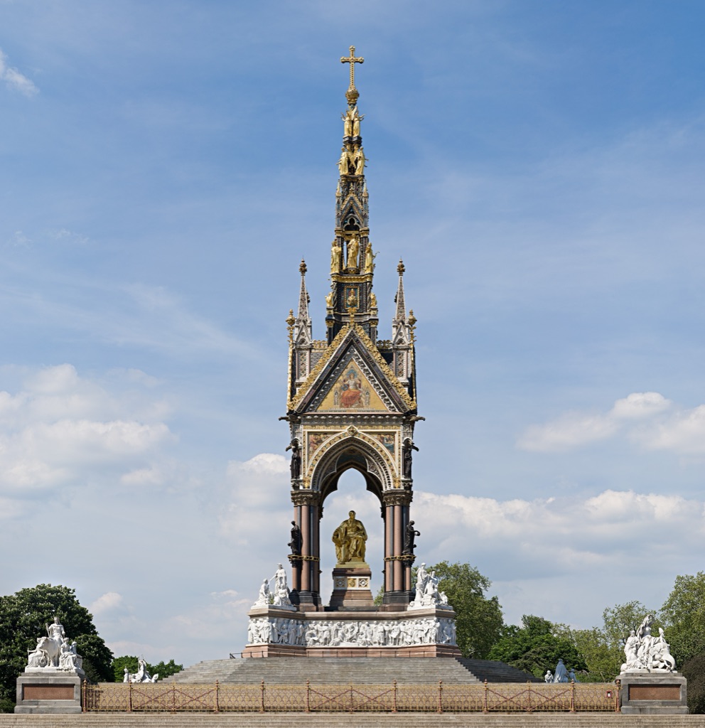 The Albert Memorial seen from the front: the gilded statue of Albert under its Gothic canopy and spire, the white marble frieze around the base, and the continent groups at the corners.