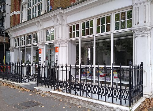 A pair of Georgian houses on Clerkenwell Green, white-painted with black railings and tall sash windows