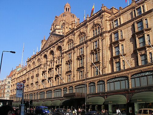 The terracotta front of Harrods on Brompton Road, with its dome and rows of arched windows