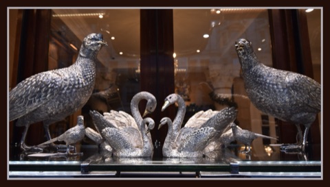 Silver birds in the window of Bentley & Skinner