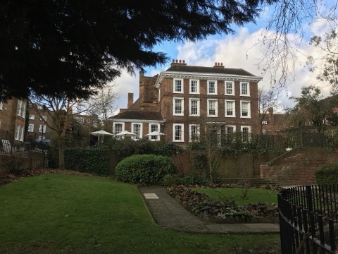 Burgh House, a brick house of 1704 in Hampstead, above its walled garden