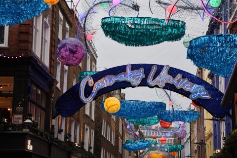Carnaby Street with decorations strung above the shops