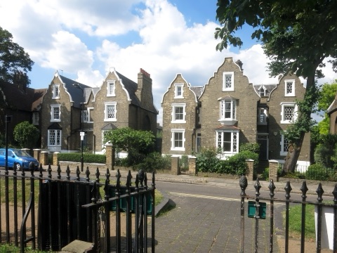 Gabled Jacobean-style houses behind railings on De Beauvoir Square
