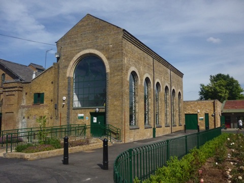 The brick engine house at Markfield, its tall arched window over the beam engine