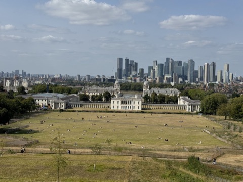 The view from Greenwich Hill down over the Queen's House to the towers of Canary Wharf
