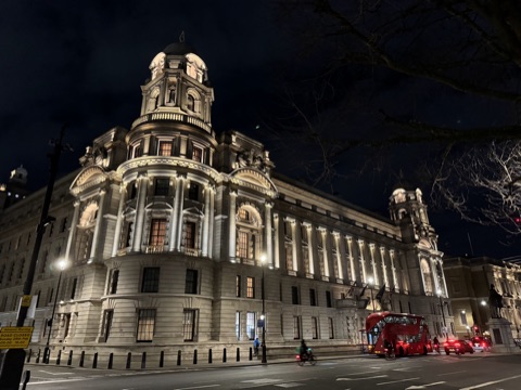 The Old War Office lit at night, its domed corner turrets above Whitehall