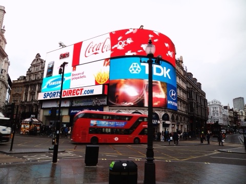 An unidentified New Routemaster , one of the route 38 trial buses based on the livery, passes through Picadilly Circus