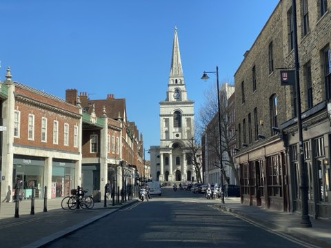 Christ Church Spitalfields at the end of Brushfield Street, its spire above the shopfronts