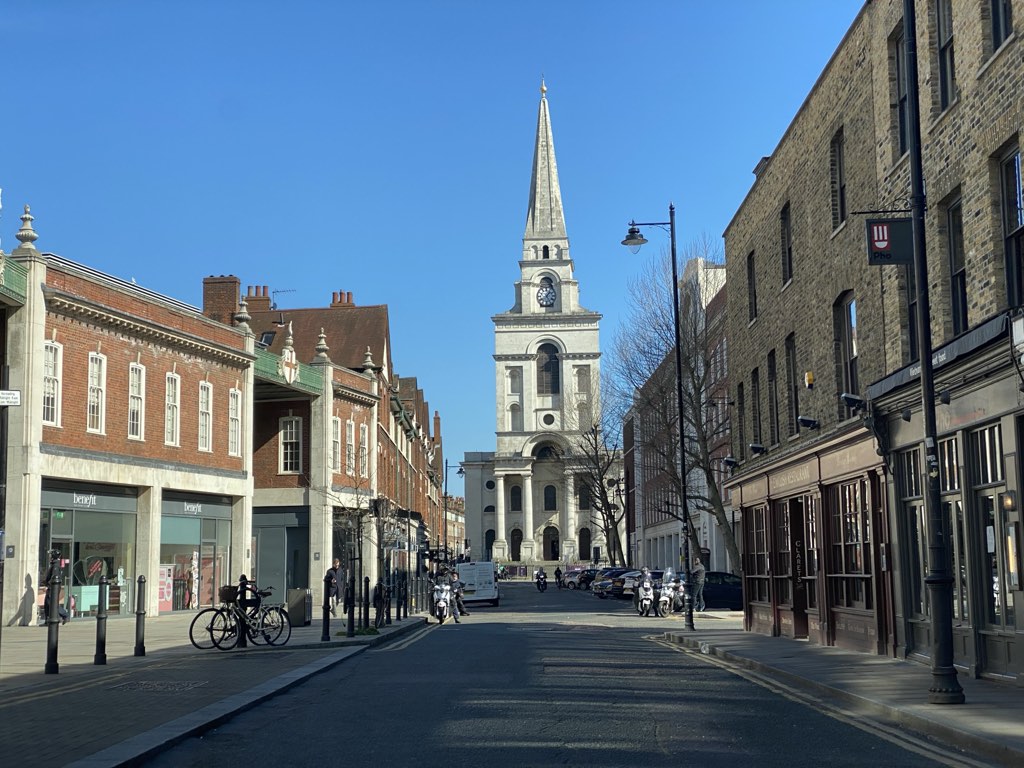 Christ Church Spitalfields at the end of Brushfield Street, its spire above the shopfronts