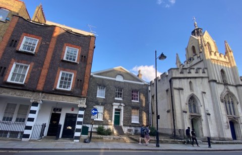Georgian houses on Bermondsey Street with the white castellated tower of St Mary Magdalen beside them