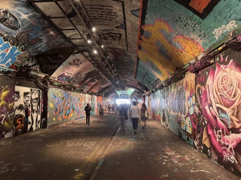 Leake Street tunnel, its walls and vaulted ceiling covered end to end in spray paint