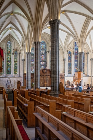 Inside Temple Church: Purbeck marble columns and a vaulted roof above the pews