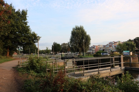 The Thames Path at Teddington Lock, grass and trees beside the lock gates