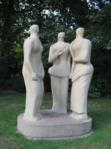 Three standing figures by Henry Moore at Battersea Park in London