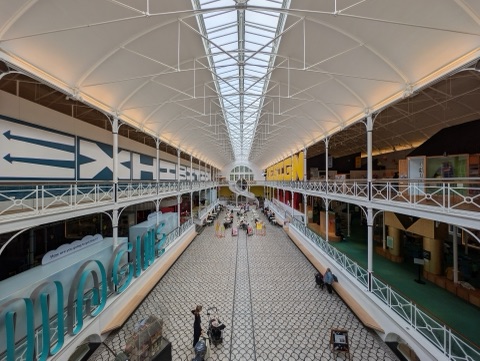 The iron and glass hall of the Young V&A, galleries running round a central space
